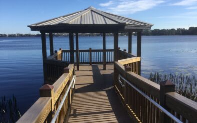 Dwell at Lake Nona by Fender Marine Construction Features Dock and Covered Deck Featuring a metal hip roof