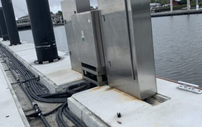 Fernandina Beach Wave Attenuator or Breakwater Driving Round Steel Pipe Pile using barge mounted crane