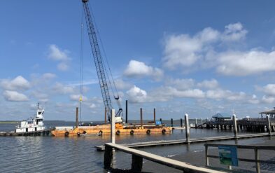 Fernandina Beach Wave Attenuator or Breakwater by Fender Marine Construction Driving Round Steel Pipe Pile using crane on barge