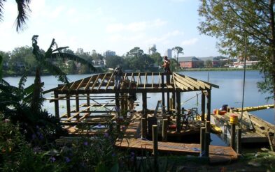 Lake Highland Boathouse Setting Round Pile and Open Beam Framing by Fender Marine