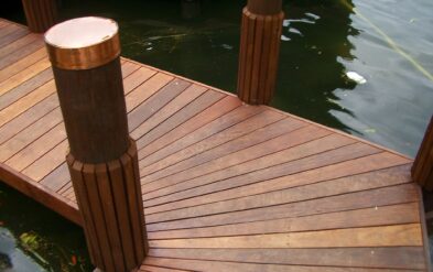 Lake Highland Boathouse with Custom Copper Pile Cap for Round Pile by Fender Marine