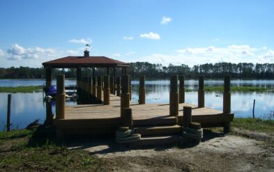 Lake Nona Custom Boathouse with Oversized Round Pile by Fender Marine