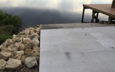 Lakeside HOA Tavares Boat Ramp Renovation with Stone Revetment along each side of the Boat Ramp to prevent scour by Fender Marine Construction