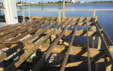 Laureate Park Restaraunt Dining Deck at Lake Nona Ipe Deck with Pile framing through Rock revetment by Fender Marine Construction