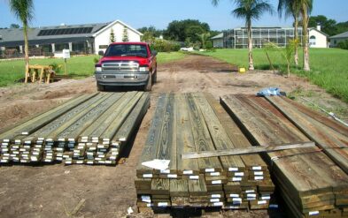 Proper Lumber Stacks for Lake Nona Custom Boathouse with Round Pile by Fender Marine